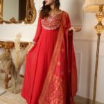 Stunning red color designer gown for wedding look