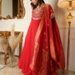 Stunning red color designer gown for wedding look